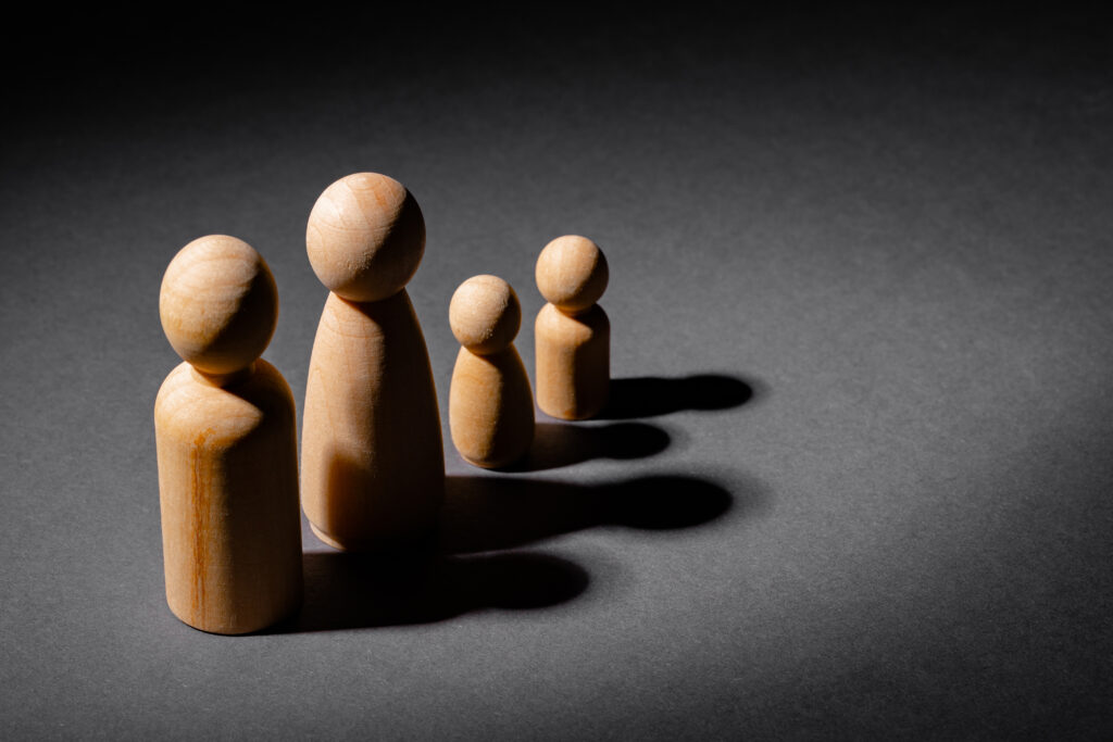 Wooden little figures of people. Family concept
